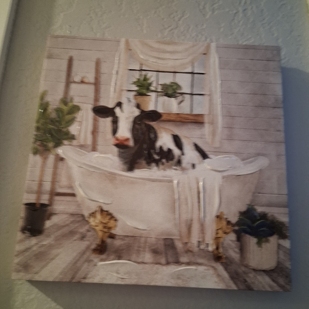 Black And White Cow in Bathtub Canvas Art